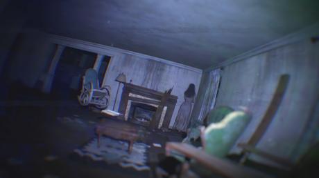 A creepy screenshot from the horror game Paranormal Tales, showing a dimly lit room with a rocking chair, fireplace, and a ghostly figure standing in the doorway