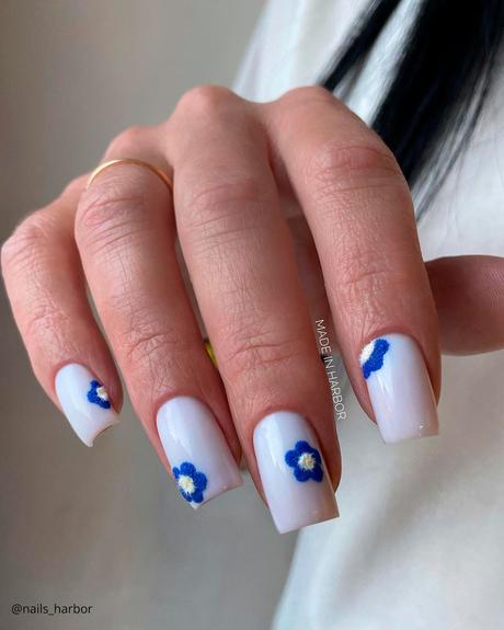 milky white nails with blue flowers nails harbor