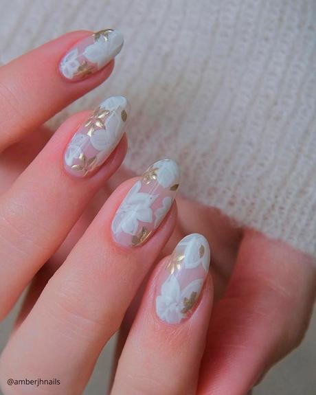 milky white nails with flowers and gold amberjhnails