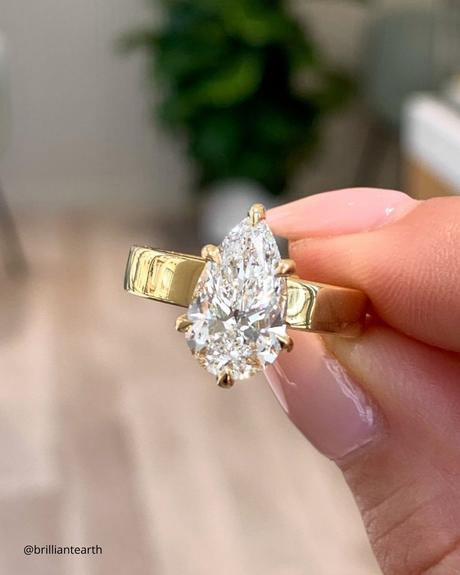 ethical engagement rings yellow gold ring with pear shaped diamond close up photo brilliantearth