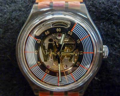 Claude 3.5 Sonata describes a photo of a Swatch watch