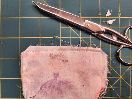 How I sew corner bookmarks Sewing a corner bookmark: trim the corners of your fabric layers, being careful not to cut through the stitching.