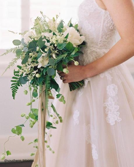 Enchanting Spring Wedding Bouquets: From Classic to Contemporary spring wedding bouquets rustic bridal bouquet with falling cascade greenery southern blooms