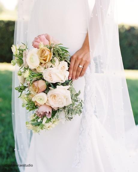 Enchanting Spring Wedding Bouquets: From Classic to Contemporary spring wedding bouquets pastel bridal bouquet in hand soft pink roses and peonies