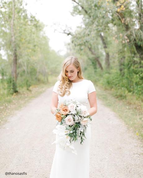 Enchanting Spring Wedding Bouquets: From Classic to Contemporary spring wedding bouquets bride looks down with her bridal bouquet in her