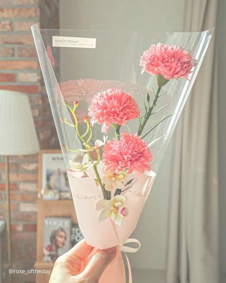 The Ultimate Guide to Using Fake Flowers for Your Wedding fake flowers the bouquet of carnation flowers wrapped in cellophane