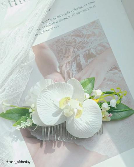 The Ultimate Guide to Using Fake Flowers for Your Wedding fake flowers tender hair clip with white fake foam orchid