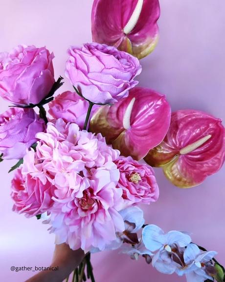 The Ultimate Guide to Using Fake Flowers for Your Wedding fake flowers latex roses and orchids in purple shades