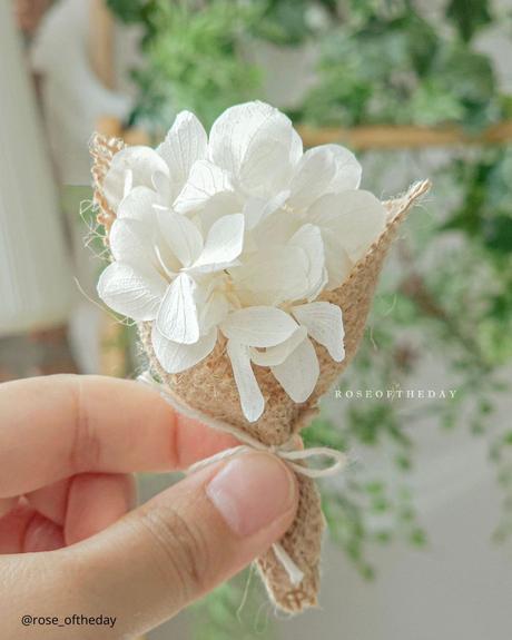 The Ultimate Guide to Using Fake Flowers for Your Wedding fake flowers small wedding boutonniere small paper bouquet