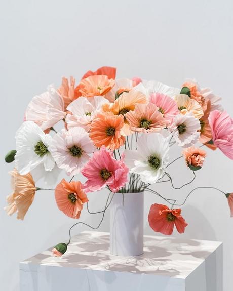The Ultimate Guide to Using Fake Flowers for Your Wedding fake flowers vase with bouquet of fake flowers in white orande and pink shades