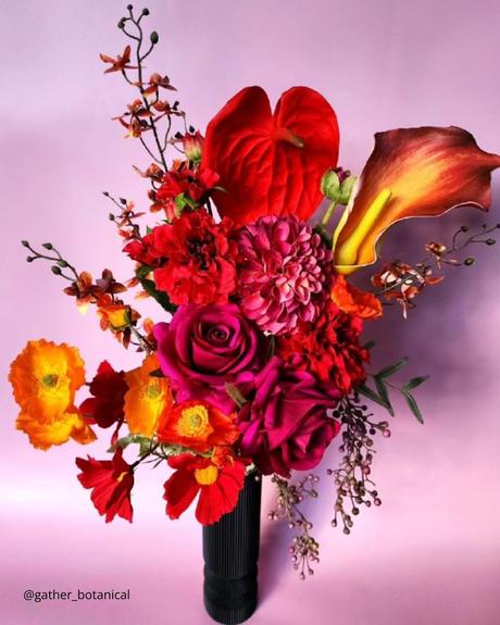 The Ultimate Guide to Using Fake Flowers for Your Wedding fake flowers fake bouquet in red and lilac shades gather botanical