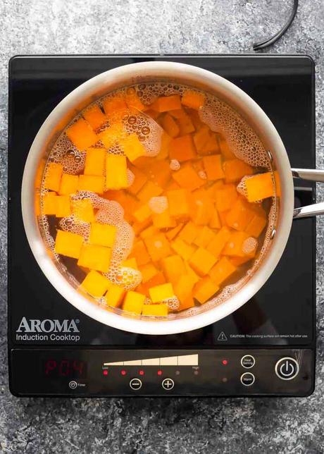 Vegetarian Enchiladas sweet potatoes in a pot of water