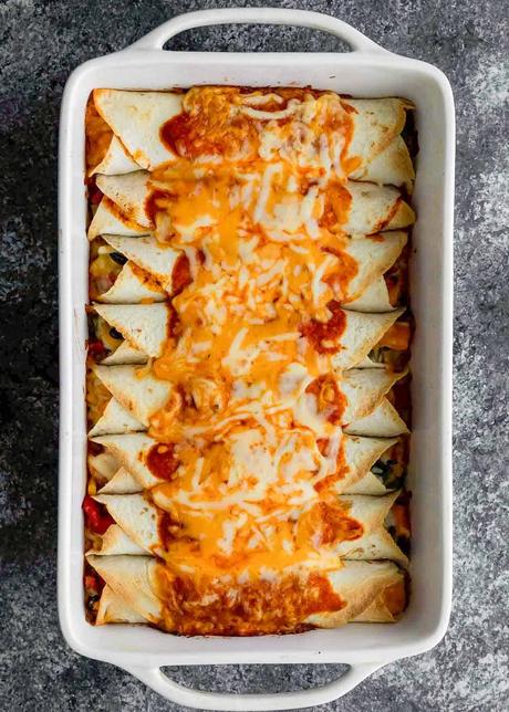 Vegetarian Enchiladas a casserole dish filled with vegetarian enchiladas