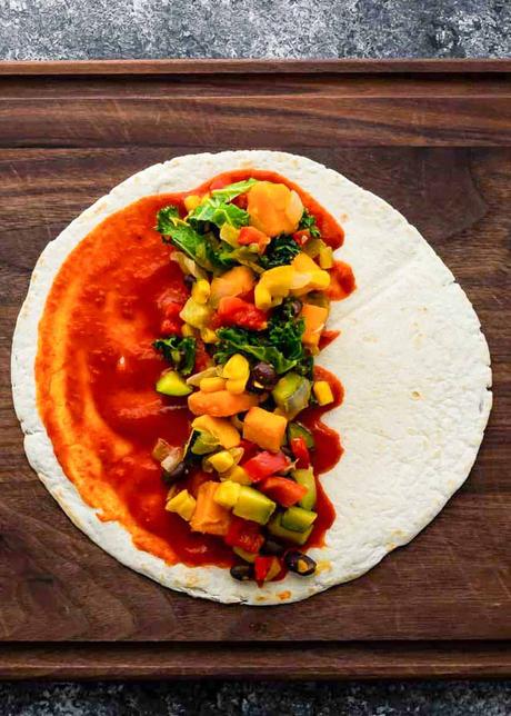 Vegetarian Enchiladas tortilla with enchilada sauce with filling