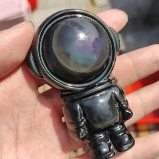 Celestial Harmony: The Art of Rainbow Obsidian Astronaut Carvings Celestial Harmony: The Art of Rainbow Obsidian Astronaut Carvings