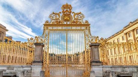 Our 4 Favorite Europe Destination Pairings Main golden door in exterior facade of Versailles Palace, Paris, France