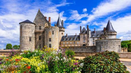 Our 4 Favorite Europe Destination Pairings Beautiful-medieval-castle-Sully-sul-Loire.-famous-Loire-valley-river-France