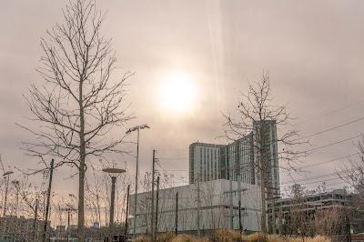 A gloomy Sunday afternoon with the sun high in the sky (behind clouds)