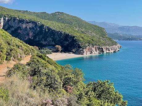 View from the path leading down to Gjipe Beach with beautiful blue sea and the untouched beach beyond