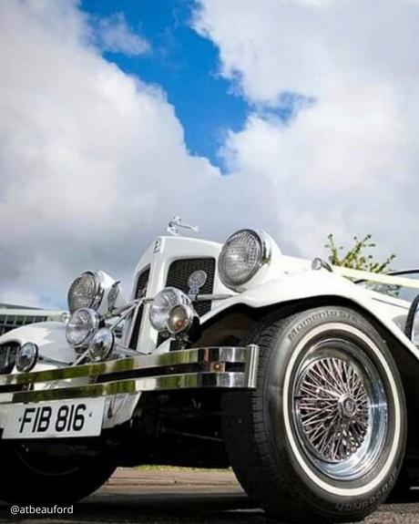 wedding car hire london white retro premium car with round headlights blue sky atbeauford