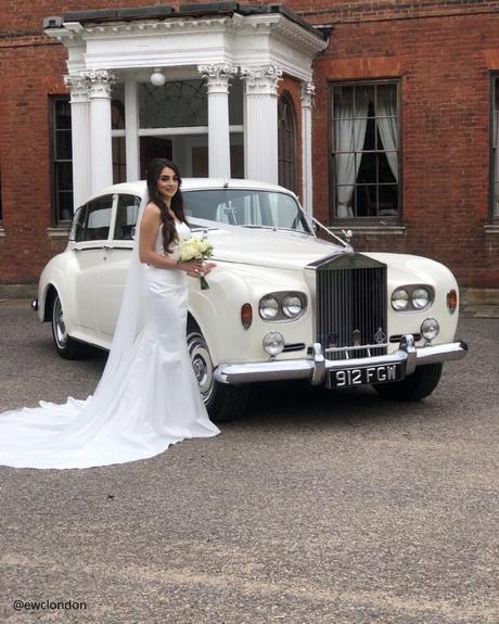 wedding car hire london bride in a dress with a bouquet circle white retro premium car ewclondon