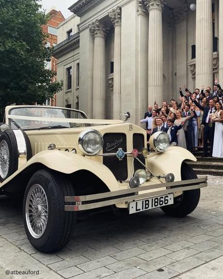 wedding car hire london beige with black retro premium car with round rear lights wedding guests atbeauford