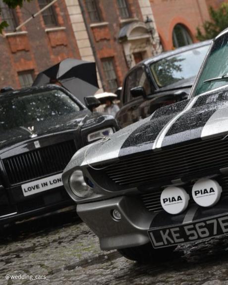 wedding car hire london two black premium retro cars with round headlights on the background of ancient building wedding cars