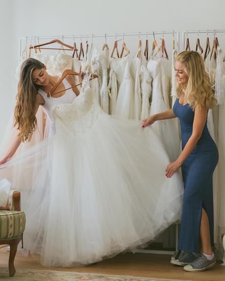 Women,Choosing,Wedding,Dress,In,Shop