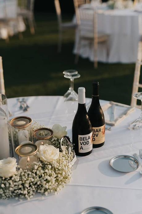 elegant-outdoor-wedding-with-candles-white-floral-details_30