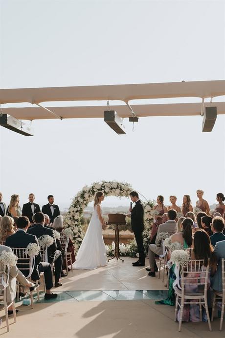 elegant-outdoor-wedding-with-candles-white-floral-details_25