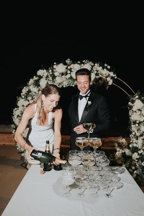 elegant-outdoor-wedding-with-candles-white-floral-details_35