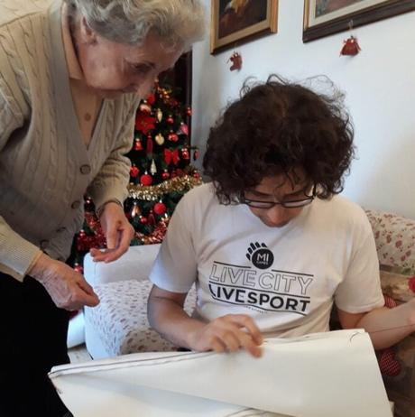Locutus and his granny inspecting the seams she made for the upholstery of our container bench
