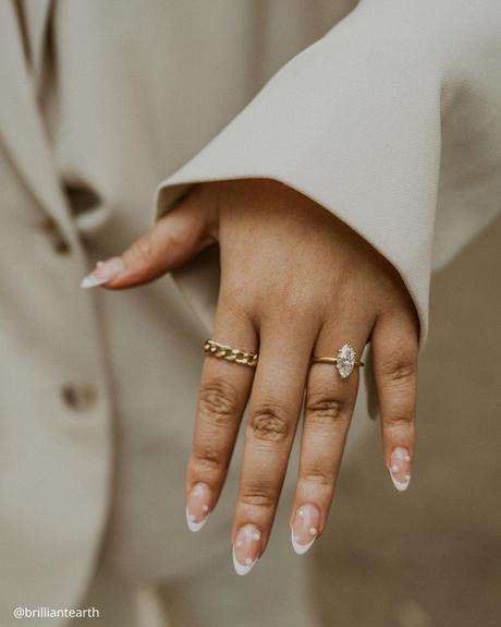 marquise engagement rings lot of yellow gold rings on a hand brilliantearth
