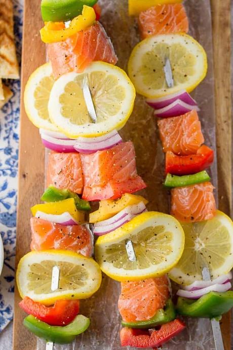 a close up shot of salmon skewers