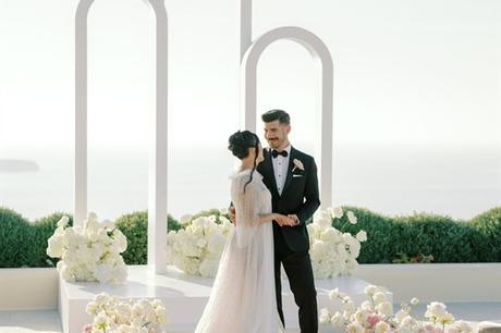 Blushing blooms and breathtaking views: A fairytale styled shoot in Santorini