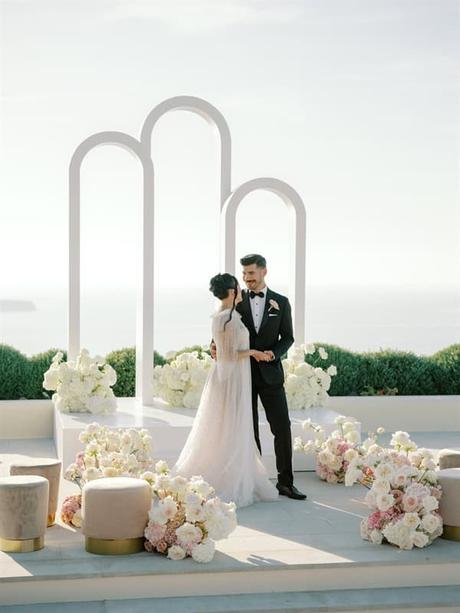 Blushing Blooms Breathtaking Views Fairytale Styled Shoot Santorini