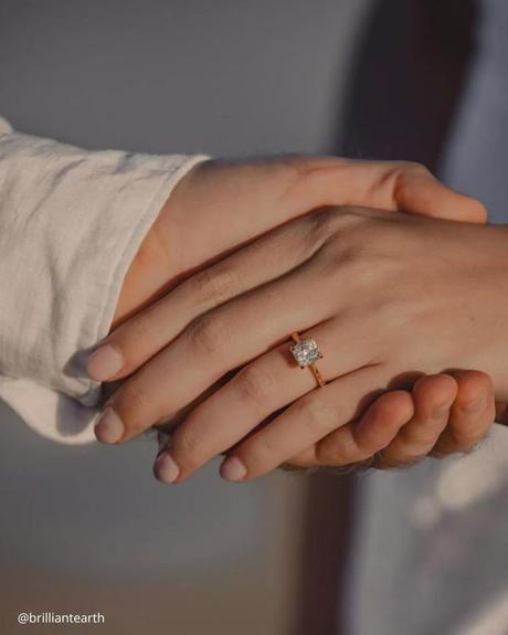 wedding ring finger hand in hand princess cut yellow gold ring brilliantearth