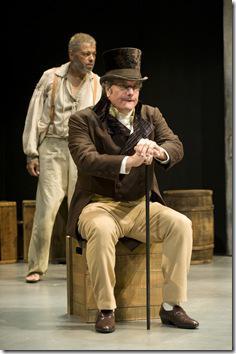 Keith Kupferer (Mister Beasley, front) takes a moment to calm himself. Dexter Zollicoffer (Deacon Simon, back) gazes squarely at his fellow prisoners.