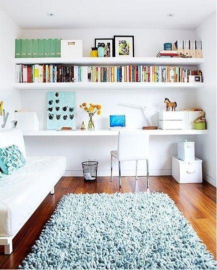 Source // Wall to wall shelving leaves room for a guest bed.