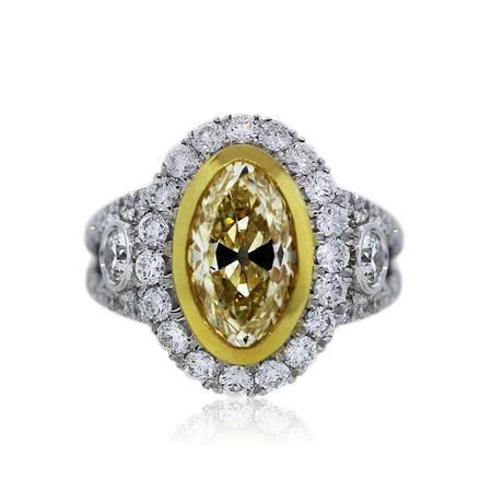 Bezel set oval fancy yellow diamond engagement ring