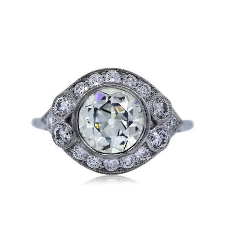 Antique style bezel set engagement ring