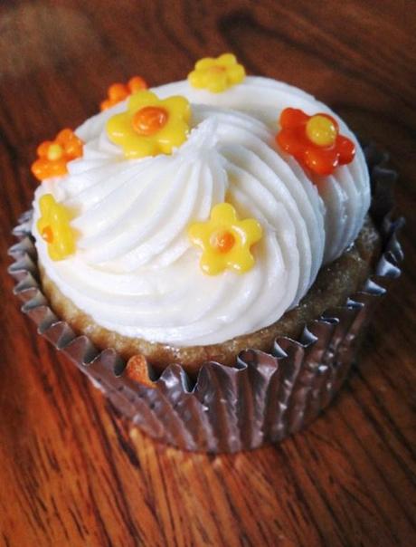 salted caramel and banana cupcakes swirl buttercream orange and yellow flower toppers recipe