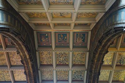 An abundance of animals A ceiling divided into squares by raised wooden strips; inside each square is a painting of a plant.
