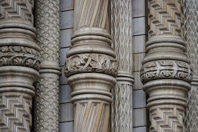 An abundance of animals Pillars lining the main doorway, decorated with plant motifs and a little mouse.