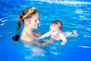 Infant swimming with swim diaper
