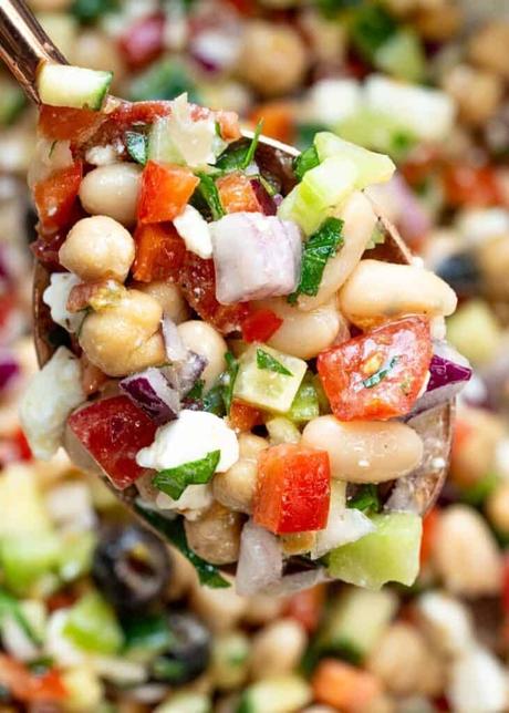 a closeup spoonful of dense bean salad