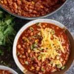 Chili Turkey Recipe an overhead shot of turkey chili in a bowl with cheddar cheese