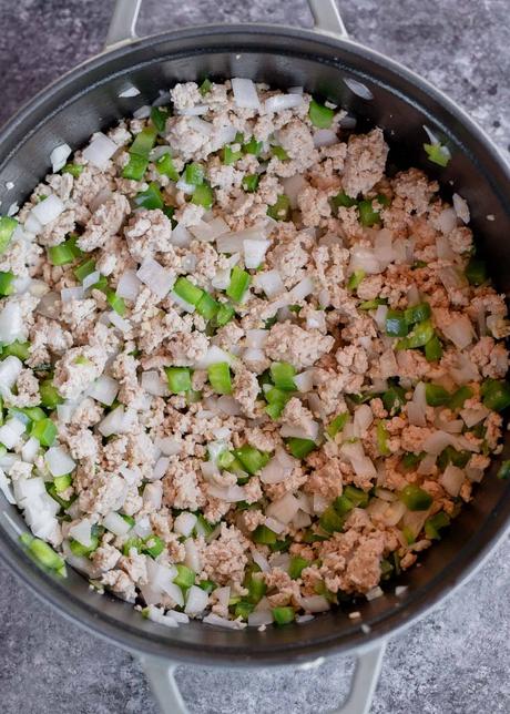 Chili Turkey Recipe ground turkey, onions and peppers in a dutch oven