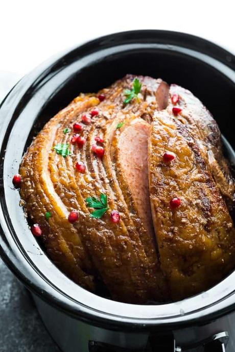 15+ Holiday Slow Cooker Recipes ham sliced with spiced honey in crock pot