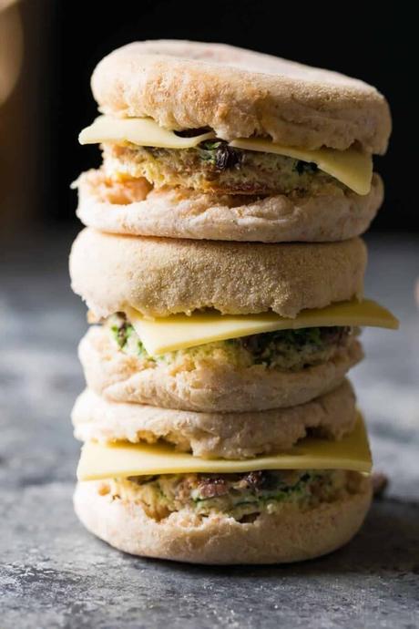 stack of three mushroom bacon swiss breakfast sandwiches